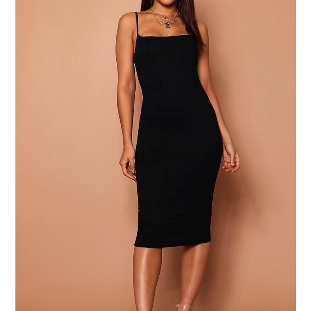 Black strappy dress.